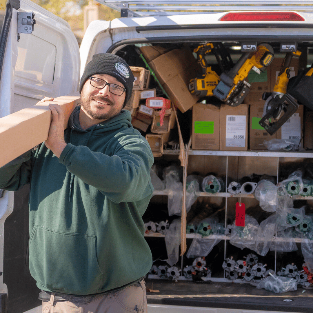 Precision Technician Carrying a Garage Door Spring