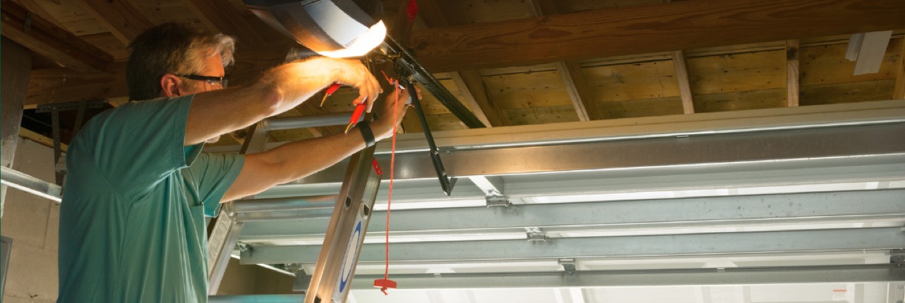 Technician Performing Maintenance on Garage Door Opener